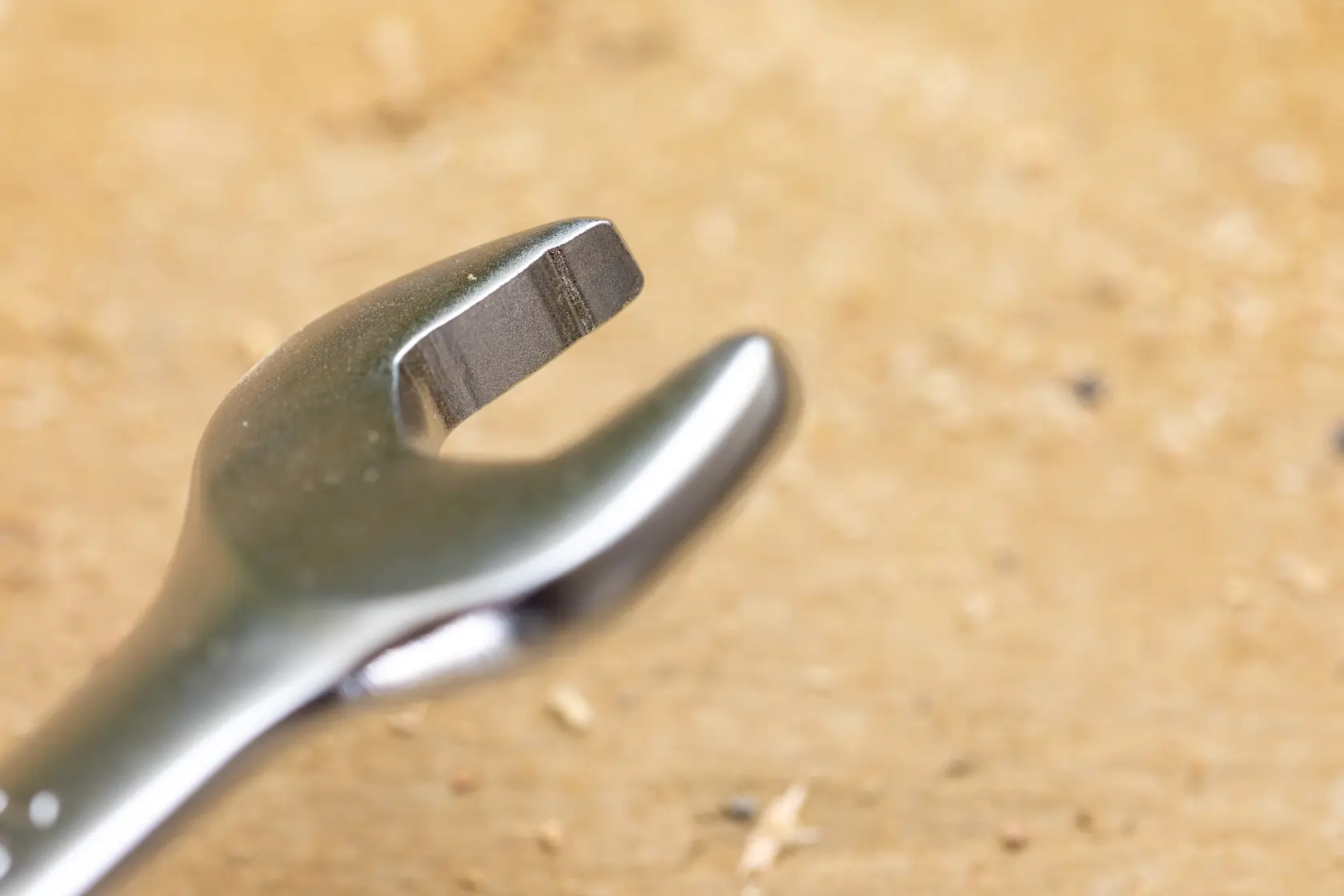 STANLEY FMMT13065-0 spanner close-up, metallic finish, tool on light brown surface.