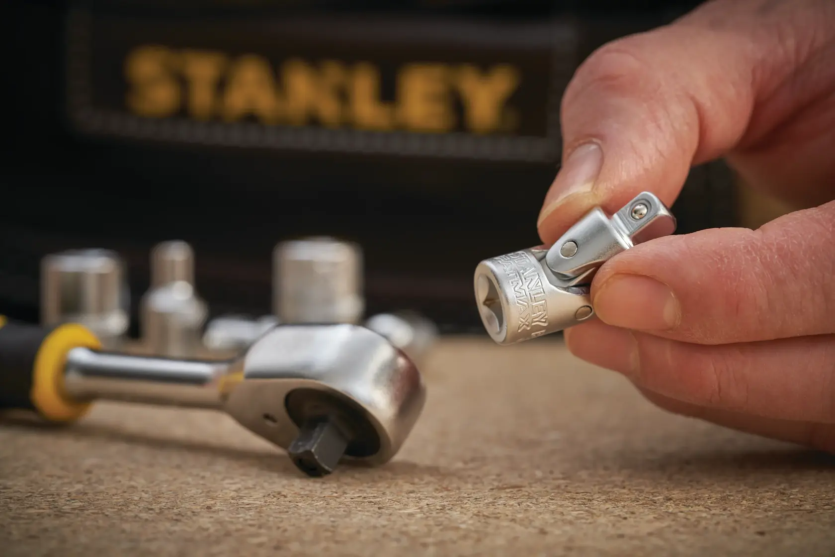 STANLEY FMMT18008-0 socket accessory photography showing close-up detail and hand holding tool.