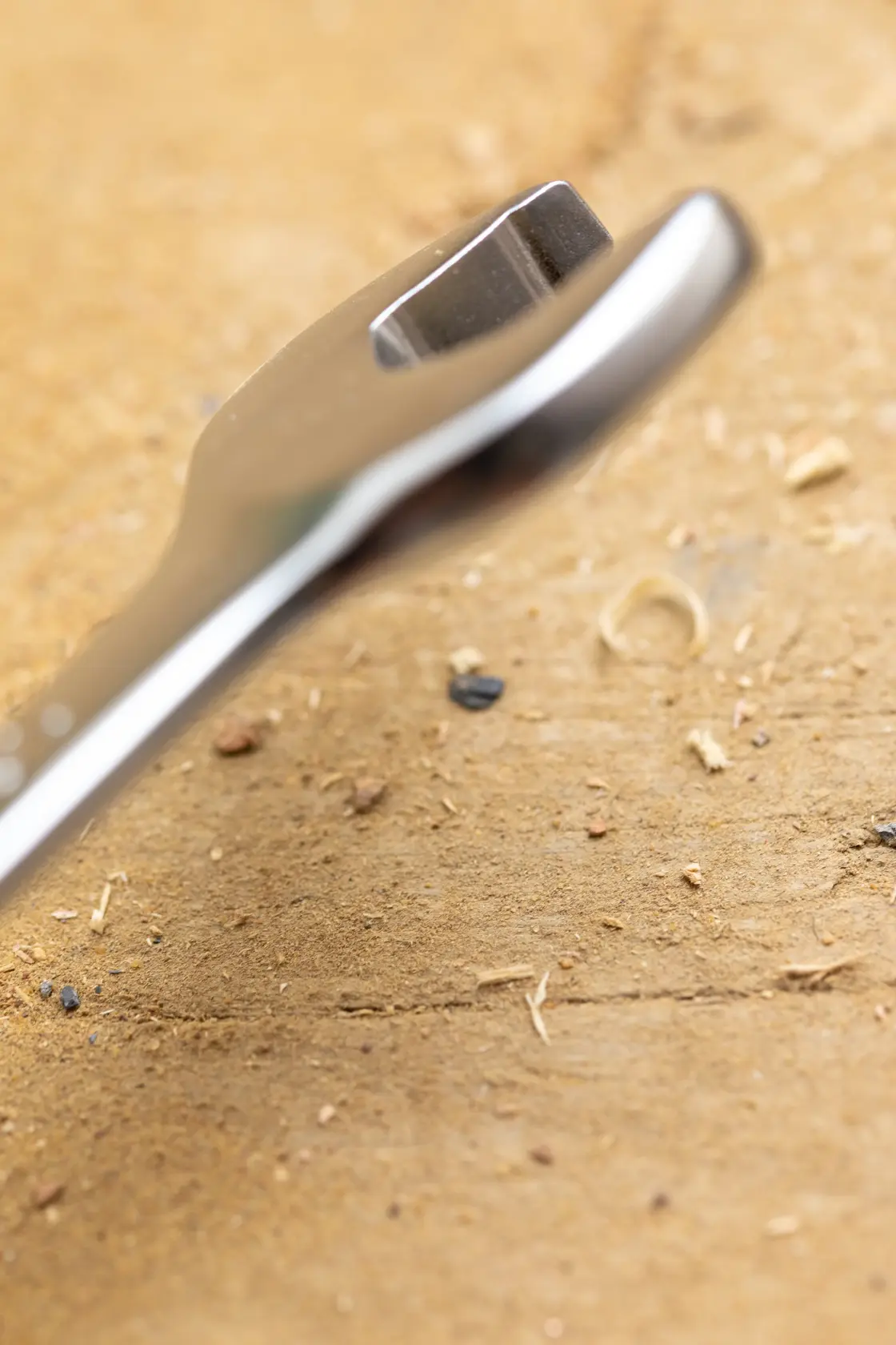 STANLEY FMMT82845-0 wrench close-up on wooden surface, focus on open end, photography category.