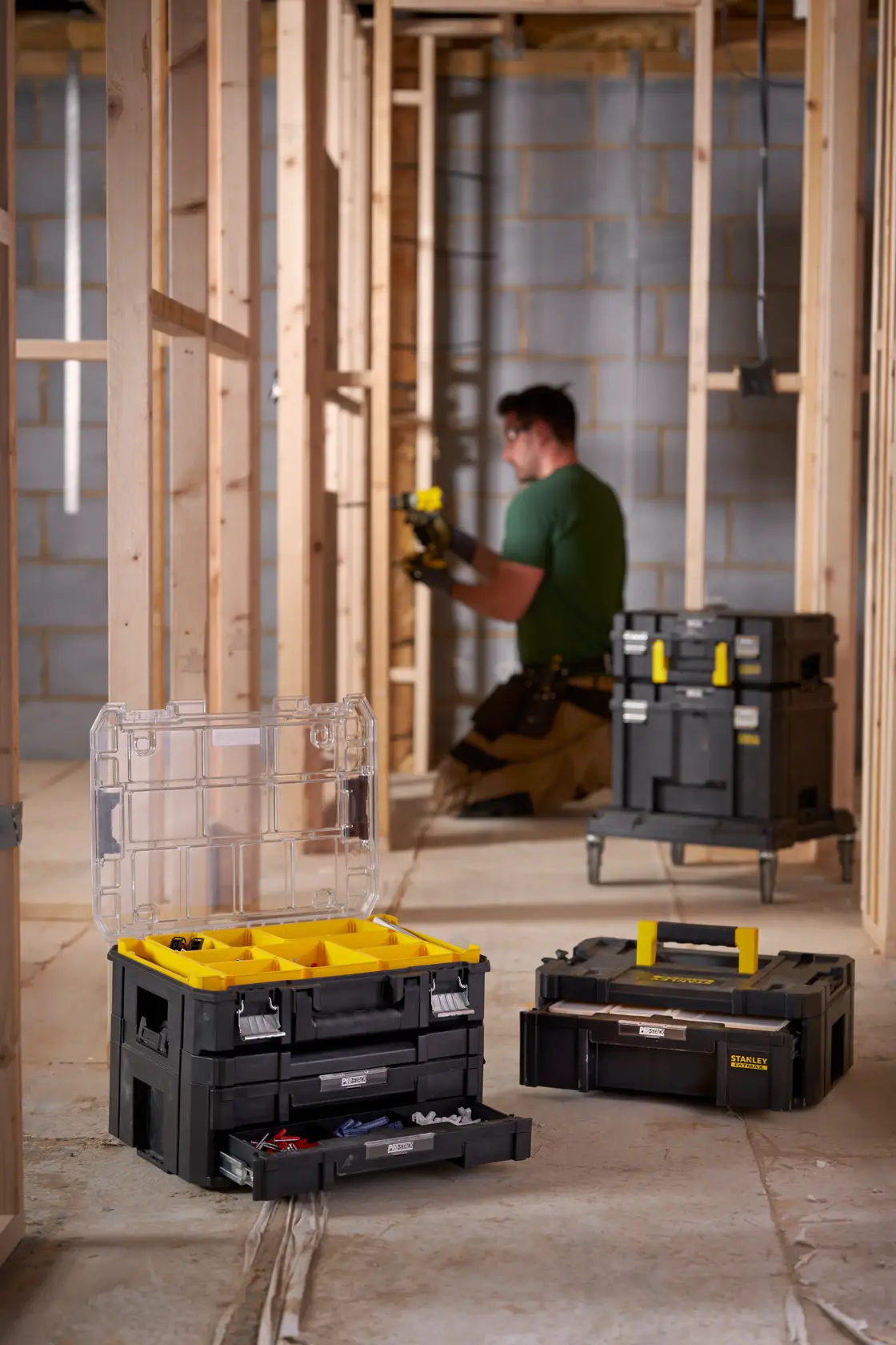 STANLEY FMST82967-9 modular black and yellow toolboxes with drawers in a construction setting.